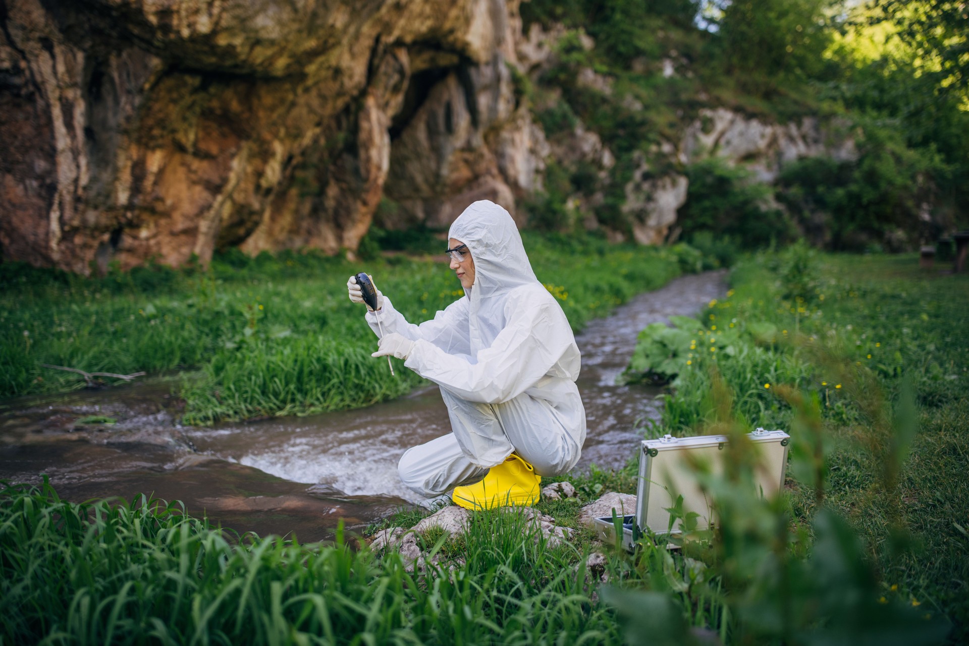 Environmental scientist conducting field research in nature