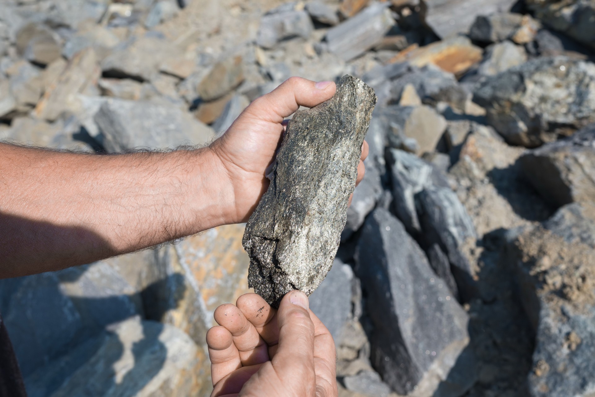 Aerial View of Graphite Deposit and Mineral Production Site Surrounded by Lush Stones
